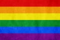 Rainbow LGBT gay flag on old paper background