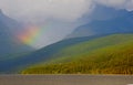 Rainbow lies in a valley in Yellowstone National Park. Royalty Free Stock Photo