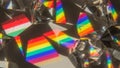 Rainbow light refractions through clear crystal prisms casting colorful spectrums on a surface Royalty Free Stock Photo