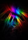 Rainbow light refracts through ice crystals in a cave, creating a vibrant display of colors on the icy surfaces. Royalty Free Stock Photo