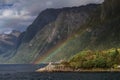 Rainbow and lighthouse at Hjorundfjord