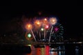 rainbow long tail fireworks on beach and reflection color on water surface Royalty Free Stock Photo