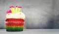 Rainbow love heart king cupcake on gray