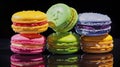 rainbow macarons on black background