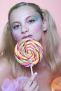 Rainbow makeup and swirl lollipop Royalty Free Stock Photo