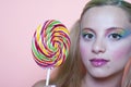 Rainbow makeup and swirl lollipop Royalty Free Stock Photo