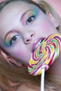 Rainbow makeup and swirl lollipop Royalty Free Stock Photo