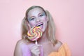 Rainbow makeup and swirl lollipop Royalty Free Stock Photo