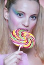 Rainbow makeup and swirl lollipop Royalty Free Stock Photo