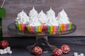 Rainbow merengue cupcakes on with rattan decoration Royalty Free Stock Photo