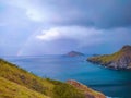 a rainbow in the middle of a sea that is so beautiful, the sea is the most comfortable place to unwind