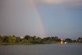 Rainbow on the moody sky with tree