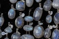 Rainbow moonstone necklage earrings jewelry on display stand in a shop market