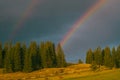 Rainbow in the mountain valley after rain. Beautiful landscape in Carpathians. Ukraine Royalty Free Stock Photo