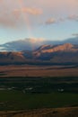 Rainbow in the mountain valley after rain. Beautiful landscape Royalty Free Stock Photo