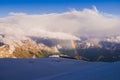 Rainbow in the mountain valley after the rain. Royalty Free Stock Photo