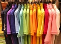 Rainbow or colorful polo shirts on hanger in shopping mall Royalty Free Stock Photo