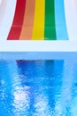 Rainbow multicoloured slide in aqua park in kids playground. Summer time activity outdoors with family. Lgbtq colours of Royalty Free Stock Photo