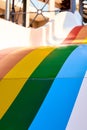 Rainbow multicoloured slide in aqua park in kids playground. Summer time activity outdoors with family. Lgbtq colours of Royalty Free Stock Photo