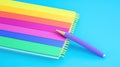 Rainbow notebook, pen, blue background, stationery Royalty Free Stock Photo
