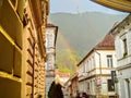 Rainbow in the old center of BraÈov. Rainy day and old house architecturure.