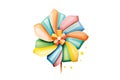 a rainbow origami pinwheel spinning in a gentle breeze