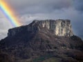 A rainbow over Bismantova stone a rock formation in the Tuscan-Emilian Apennines Italy