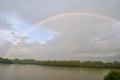 Rainbow over the river Royalty Free Stock Photo