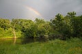 Rainbow Over Bridge With Lush Green Forestry all Around Royalty Free Stock Photo