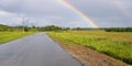 Rainbow over countryside road