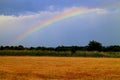 Rainbow over field near small town Stupava, ZÃÂ¡horie Royalty Free Stock Photo