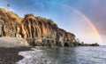 Rainbow over Formosa black beach in Madeira, Portugal Royalty Free Stock Photo