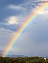 Rainbow over green hill