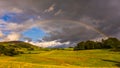 Rainbow over green hills in North UK