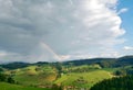 Rainbow over green Hills Royalty Free Stock Photo