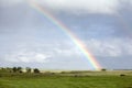 Rainbow over green pasture