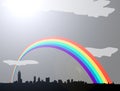 Rainbow over grey cloudy city skyline Royalty Free Stock Photo