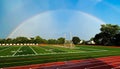 Rainbow over a high school athletic field Royalty Free Stock Photo