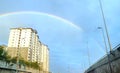 Rainbow over the higway road with apartment building Royalty Free Stock Photo