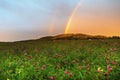 Rainbow over hill at sunset, Kozakov hill, Czech republic. Royalty Free Stock Photo