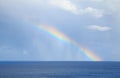 rainbow over the horizone at sea Royalty Free Stock Photo