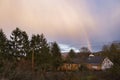Rainbow over house in Potzbach Royalty Free Stock Photo
