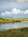 Rainbow over a lake Royalty Free Stock Photo