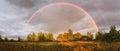 Rainbow over the lake in summer evening Royalty Free Stock Photo