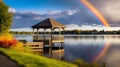 Rainbow over a lakeside gazebo