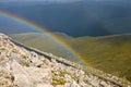 Rainbow over mountain valley Royalty Free Stock Photo