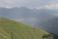 Rainbow over mountains in a sunny day Royalty Free Stock Photo
