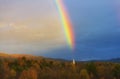 A rainbow over a New England church steeple Royalty Free Stock Photo