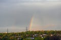 Rainbow over the park in sunny spring day Royalty Free Stock Photo