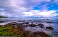 Rainbow over the popular surfing place Sunset Beach , Oahu, Hawaii Royalty Free Stock Photo